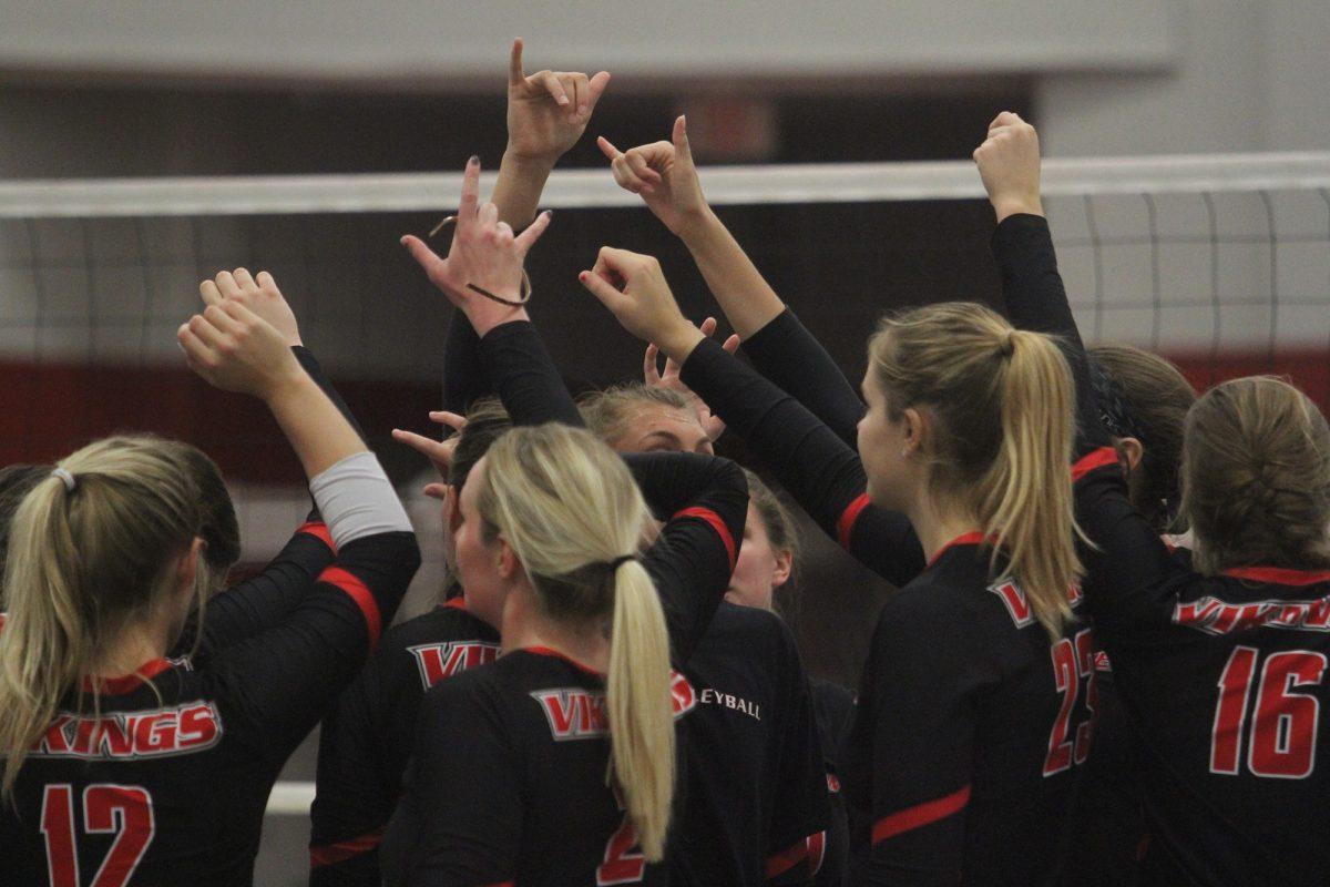 The Vikings women’s volleyball team gathers together in a chant before the match against Rocky Mountain College on Friday, October 13.
