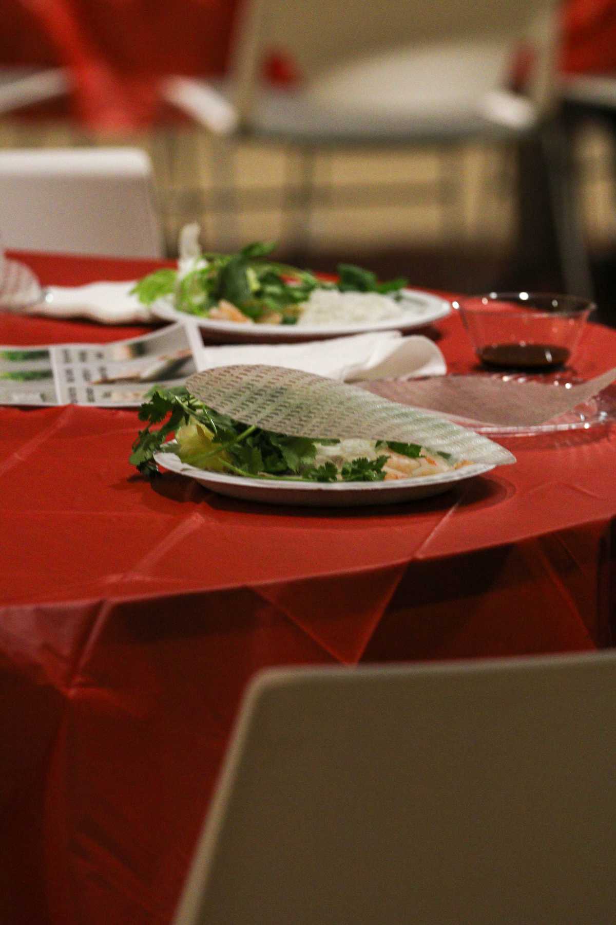 Students collect ingredients to make spring rolls in the Speed Lyceum at Grand View University in Des moines, Iowa on March 12th, 2025.