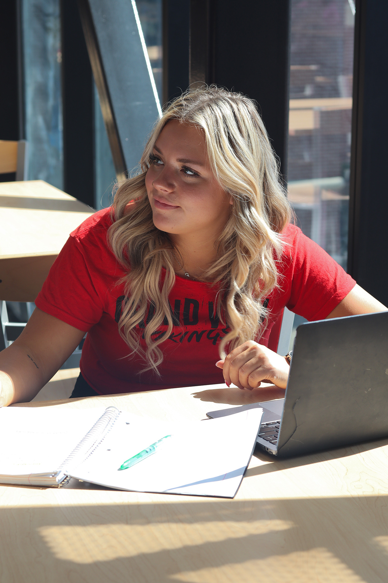 GVU Student, Ella Hutchinson, looks up on GV Campus.