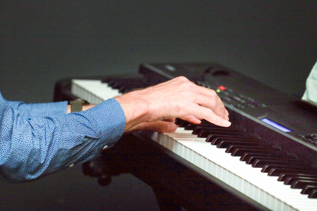 Nick Rueckert strikes the keys in the back of The Contrary in Des Moines, Iowa on Sunday, September 21, 2025.