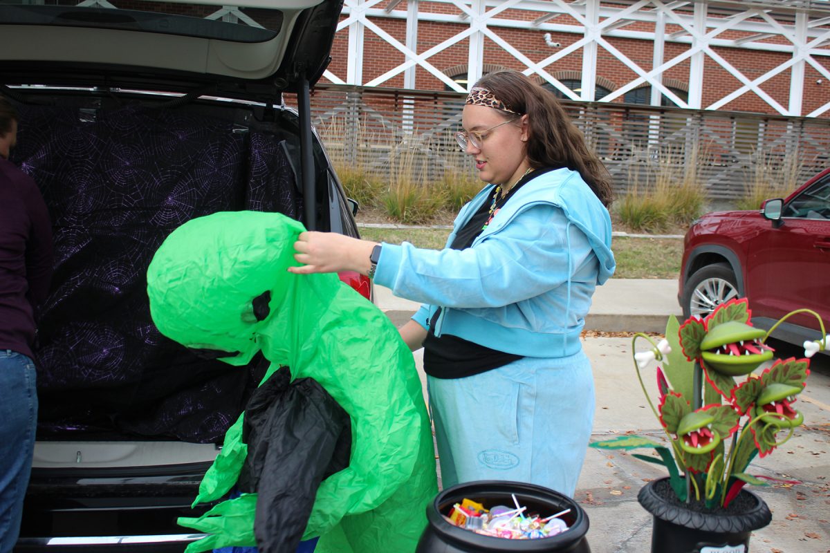 Jordan Lipinski inflates an inflatable alien at the Keller Williams Trunk or Treat event in West Des Moines, Iowa, on Thursday October 30, 2025. 

Charlee Heffron