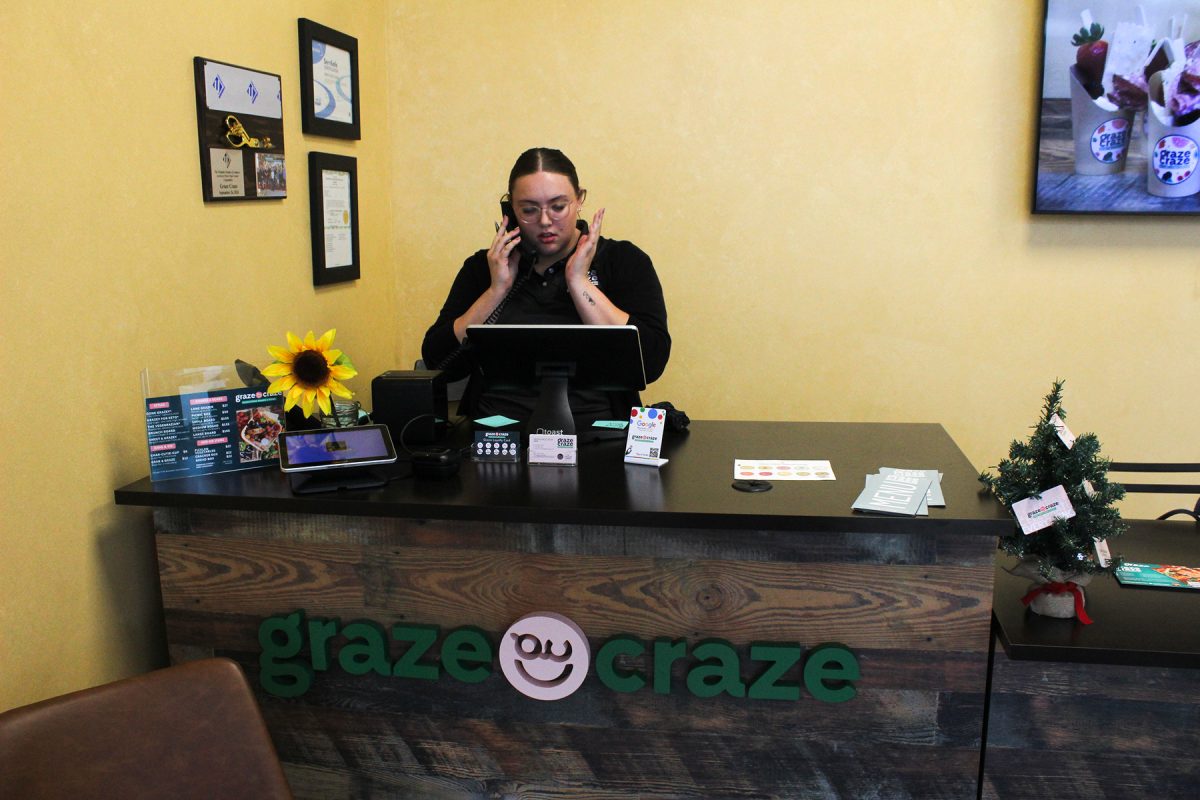 Jordan Lipinski handles an unsatsfied customer over the phone at Graze Craze Charcuterie Boards & Boxes in Urbandale, Iowa on Thursday, November 20, 2025.

Charlee Heffron