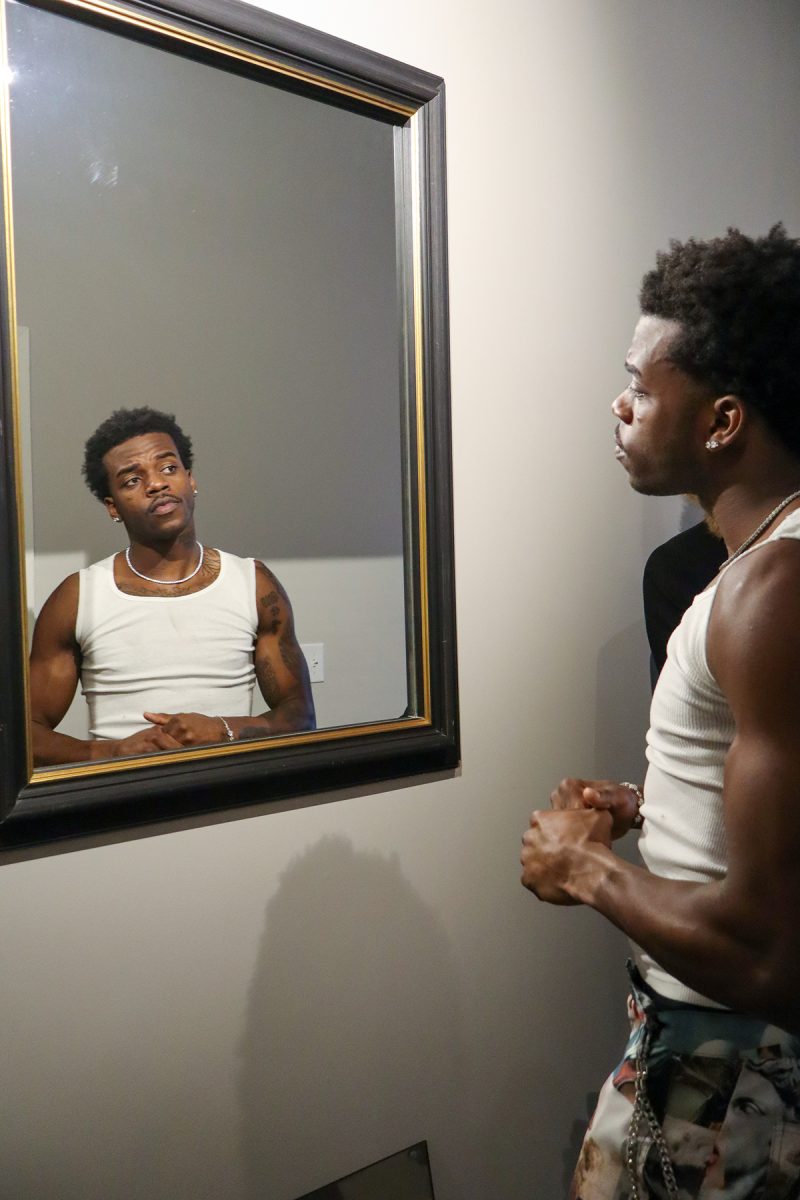 At Jordan’s apartment in Des Moines, Iowa on Saturday, November 26th, 2025, he looks in the mirror to get hyped up.