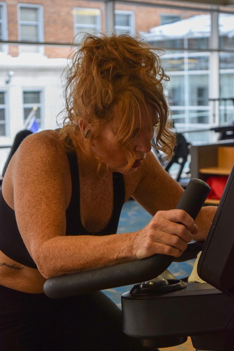 Sommer Walton uses the stationary bike at the Wellmark YMCA downtown on November 30, 2025. 