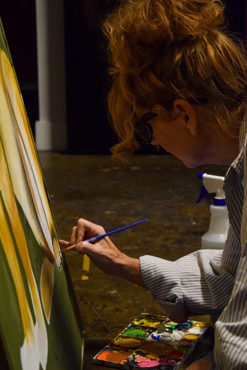 Summer Waltons paints with detail  in her downtown Des Moines loft on November 13, 2025. 