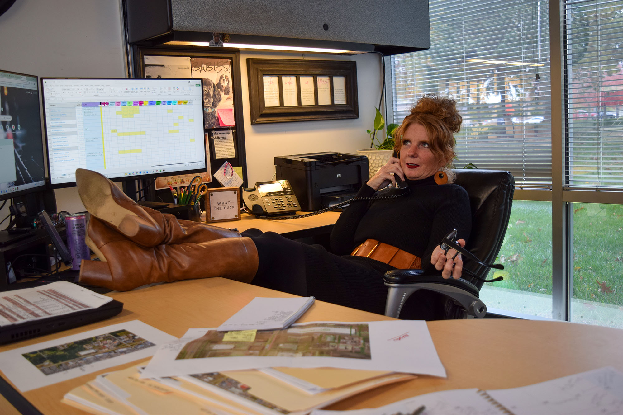 Sommer Walton kicks her feet back while she’s on the phone in her office in Ankeny, Iowa on October 31, 2025. 