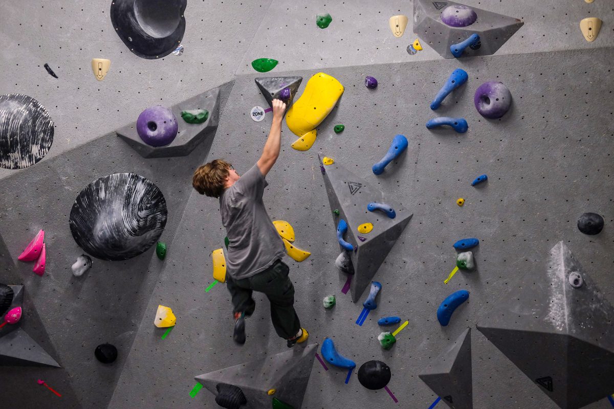 Milos Garton slips and begins to fall from a climb in Climb Iowa’s East Village location in Des Moines, Iowa on Thursday, November 6, 2025