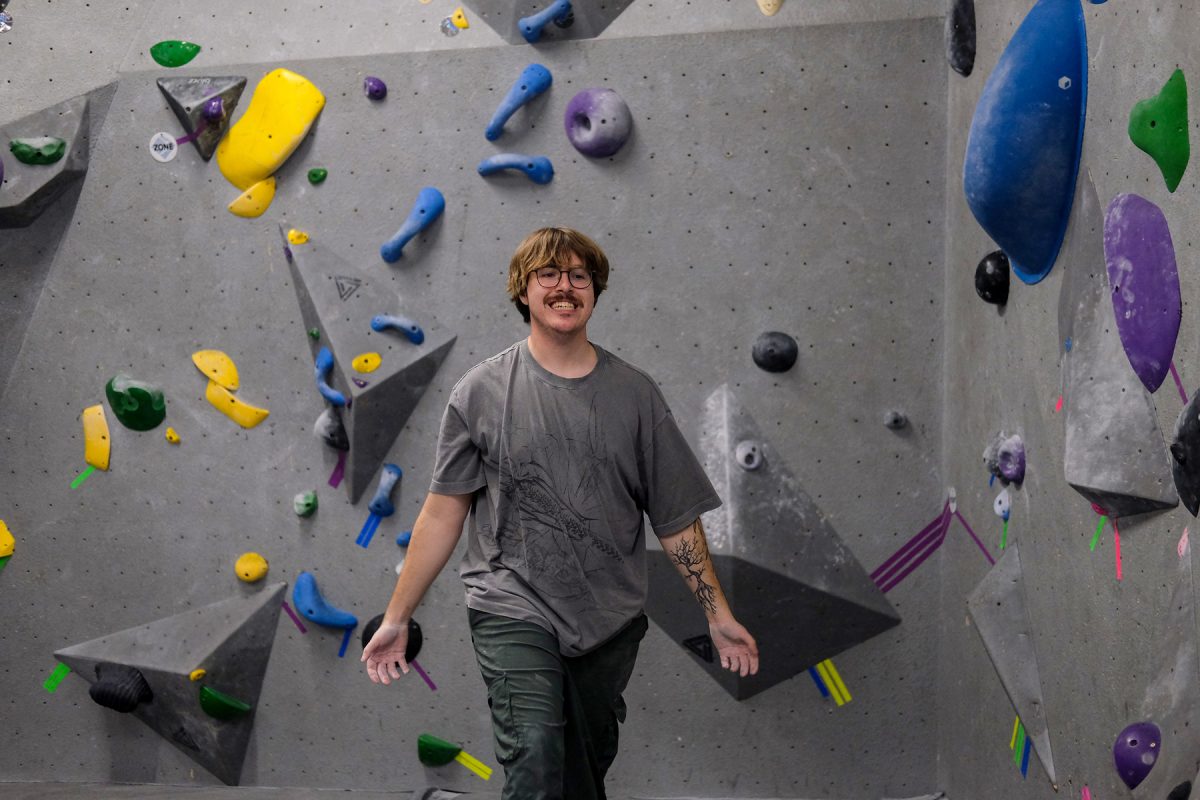 Milos Garton winces after failing a climb he was working on in Climb Iowa’s East Village location in Des Moines, Iowa on Thursday, November 6, 2025