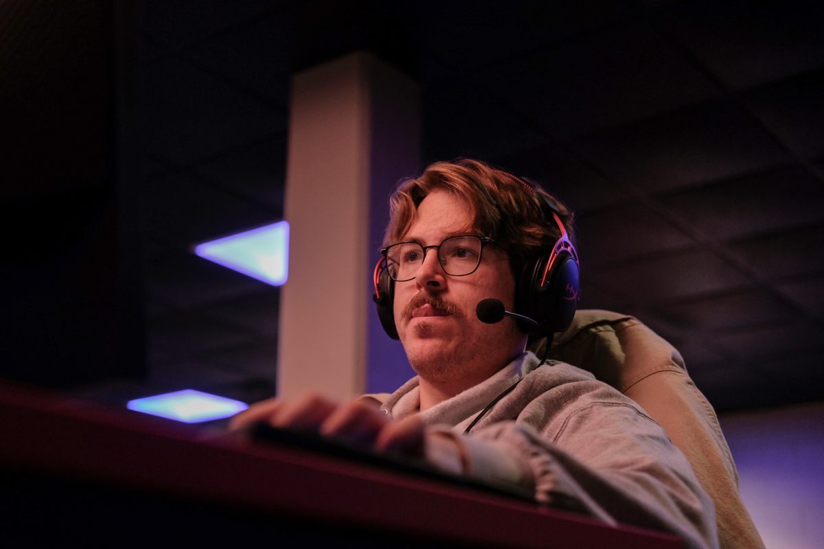 Milos Garton sticks his tongue out in concentration during an internal scrimmage in the Esports Arena at Grand View University in Des Moines, Iowa on Friday, December 5, 2025. 