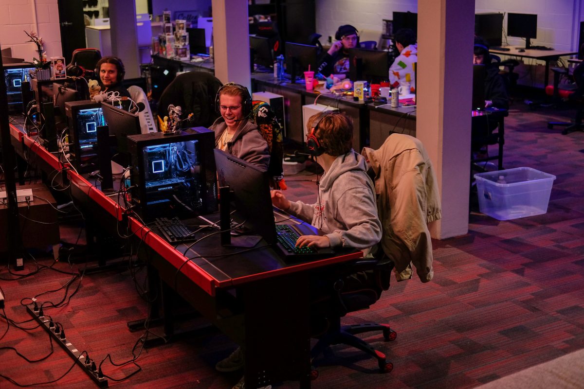 Milos Garton banters with the people around him during an internal scrimmage in the Esports Arena at Grand View University in Des Moines, Iowa on Friday, December 5, 2025. 